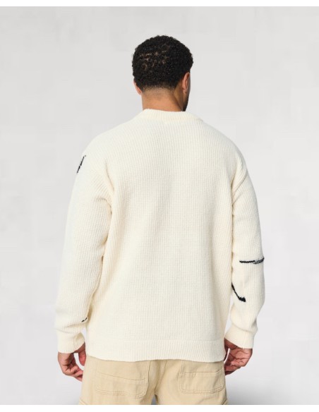 Pull beige en maille lignes artistique
