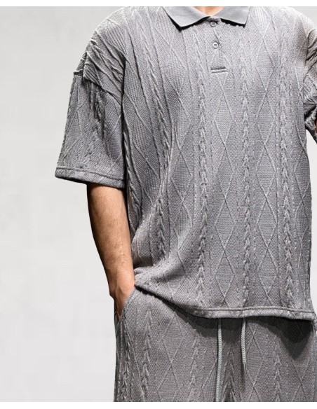 Polo gris foncé en maille géométrique